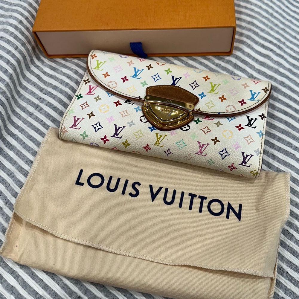 Lv Murakami long wallet with pink lining in good condition
